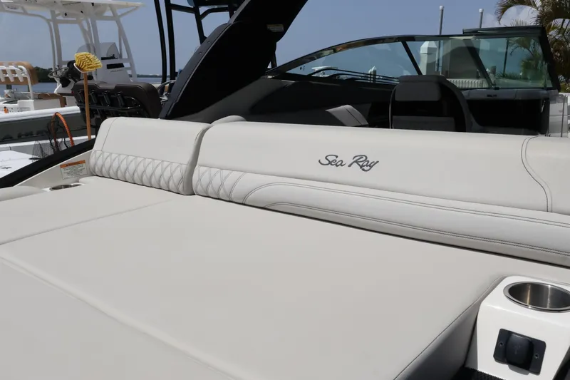 Slide: The Image of 2024 Sea Ray SLX 260 Outboard boat interior with luxurious seating and cup holder. - 43