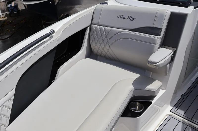 Slide: The Image of 2024 Sea Ray SLX 260 Outboard boat interior with luxurious seating and armrest. - 17