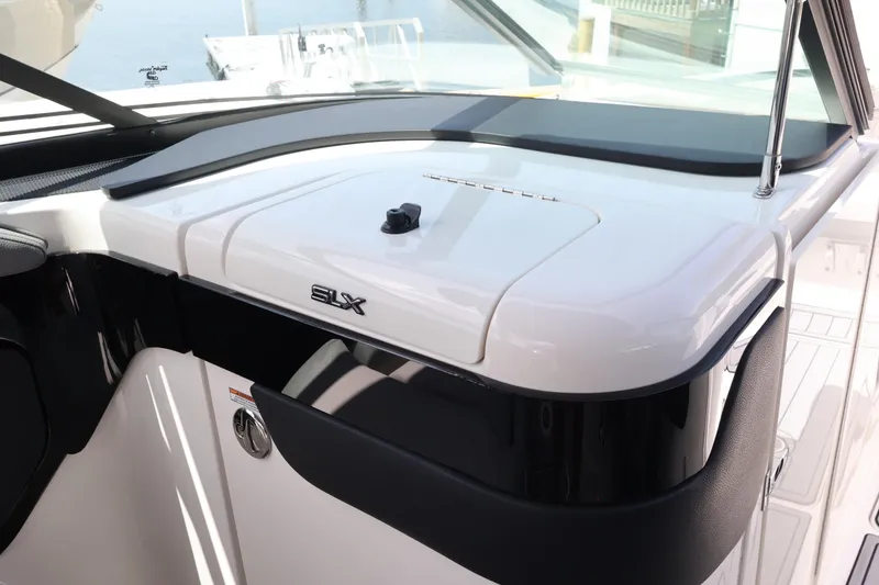 Slide: The Image of 2024 Sea Ray SLX 260 Outboard dashboard with sleek design and modern features. - 31