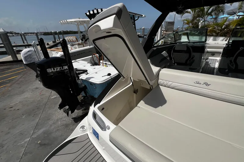Slide: The Image of 2024 Sea Ray SLX 260 Outboard boat with Suzuki engine at dockside. - 45