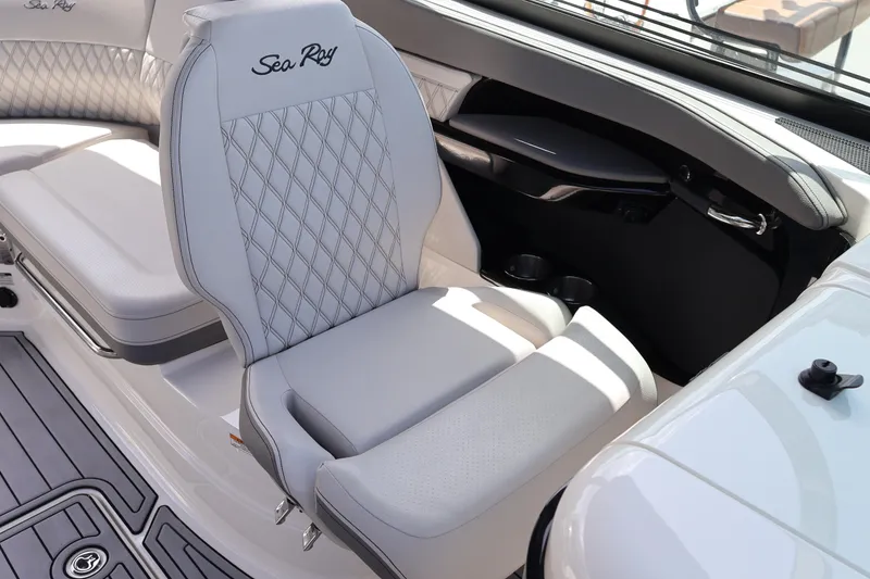 Slide: The Image of Luxurious interior seating of 2024 Sea Ray SLX 260 Outboard boat, featuring elegant design and comfort. - 27