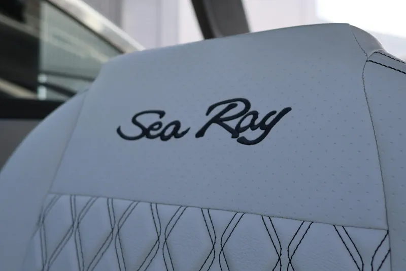 Slide: The Image of 2024 Sea Ray SLX 260 Outboard seat with embroidered logo detail. - 32