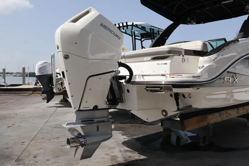 Slide: The Image of 2024 Sea Ray SLX 260 Outboard boat with Mercury engine at dockside. - 10