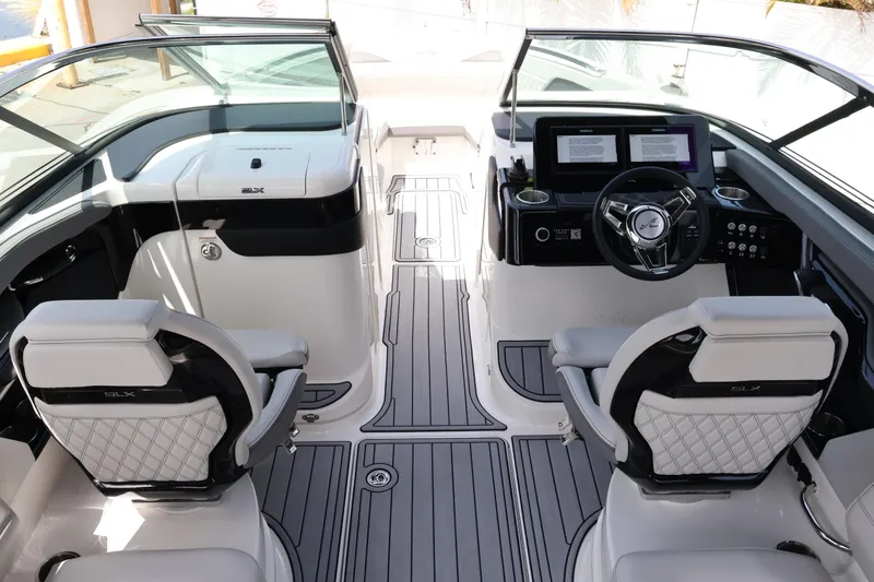 Slide: The Image of 2024 Sea Ray SLX 260 Outboard interior with modern helm and luxurious seating. - 20
