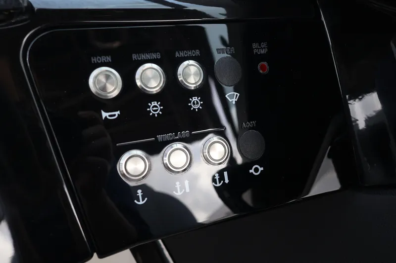 Slide: The Image of Control panel of 2024 Sea Ray SLX 260 Outboard with various function buttons. - 24