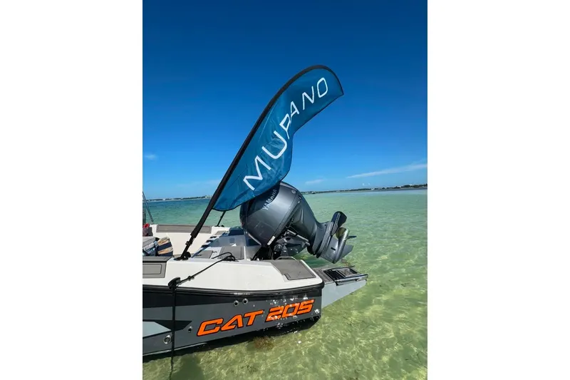 Slide: The Image of Boat in clear water, Murano 205 model, 2026, with visible engine and branding. - 4