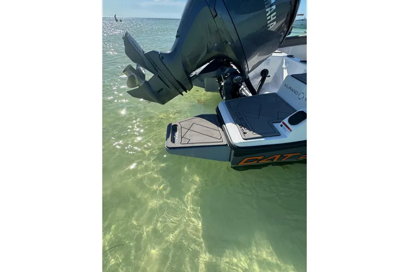 Slide: The Image of 2026 Murano 205 boat with Yamaha engine in clear shallow water. - 8
