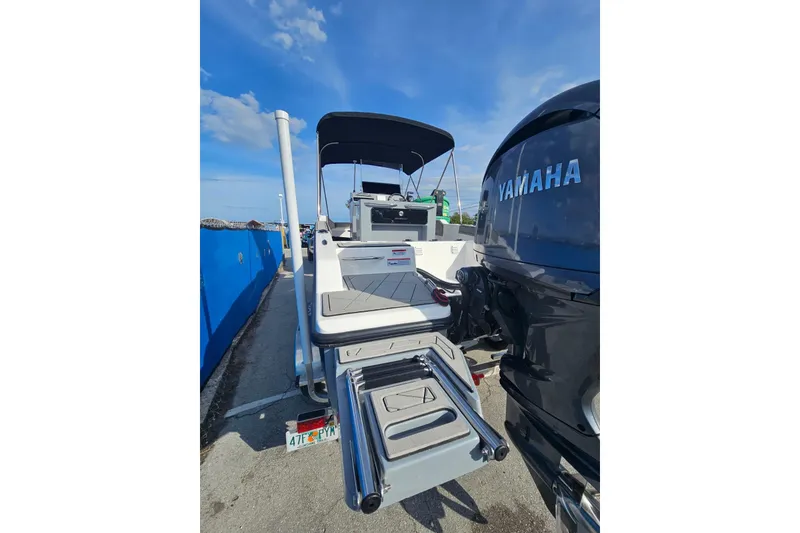 Slide: The Image of 2026 Murano 205 boat with Yamaha engine, docked under clear blue sky. - 29