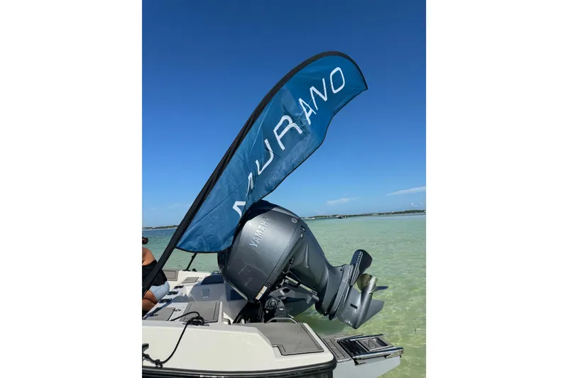 Slide: The Image of 2026 Murano 205 boat with Yamaha motor on clear water, blue sky background. - 9