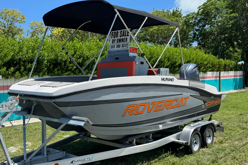 Slide: The Image of 2026 Murano 205 Rovercat boat for sale on trailer, featuring canopy and outboard motor. - 10
