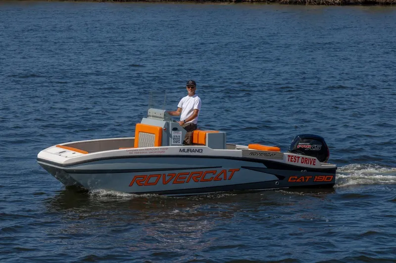 Slide: The Image of Man driving Murano 205 Rovercat boat on water, 2026 model, test drive. - 13