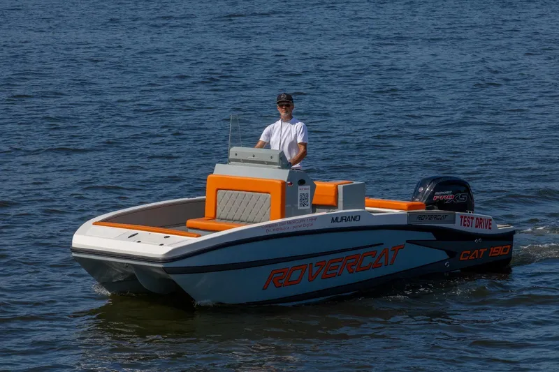 Slide: The Image of A 2026 Murano 205 boat on water, featuring orange accents and a test drive sign. - 14