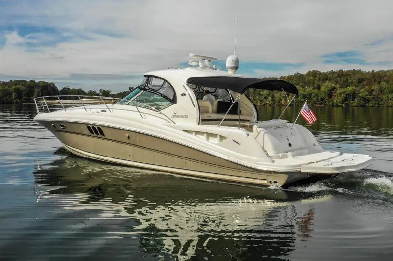 The Image of 2006 Sea Ray Sundancer 44 cruising on a calm lake. - 0