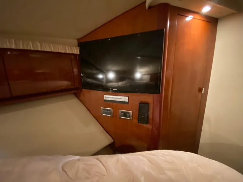 Slide: The Image of Interior of 2006 Sea Ray Sundancer 44 with TV and entertainment system. - 23