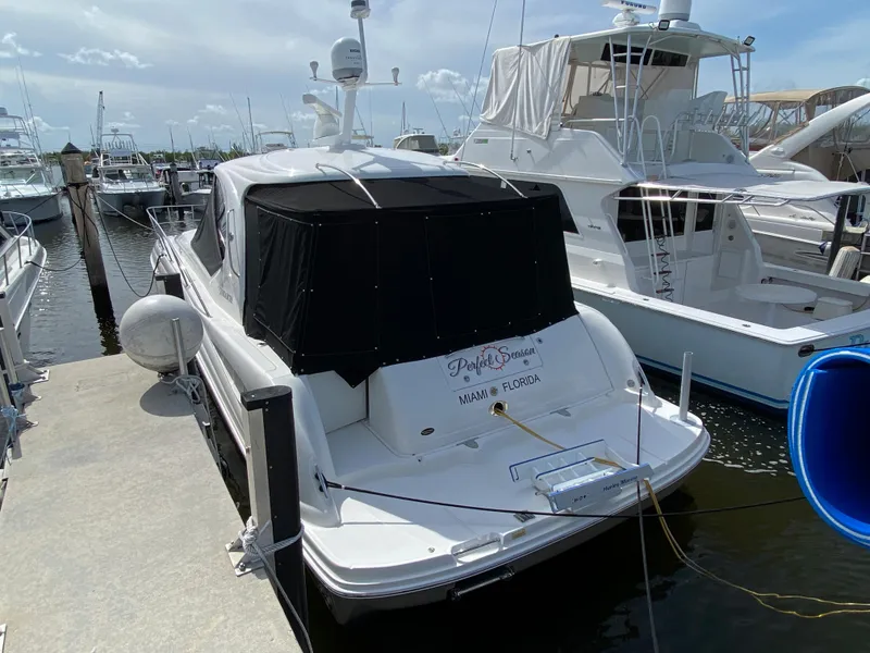 Slide: The Image of 2006 Sea Ray Sundancer 44 docked at marina. - 1