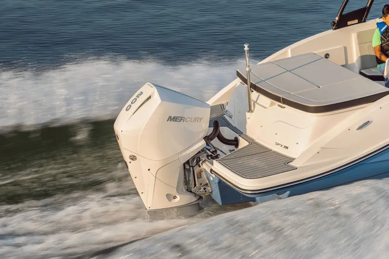 Slide: The Image of A 2024 Sea Ray SPX 230 Outboard speeds across the water, featuring a Mercury engine. - 17
