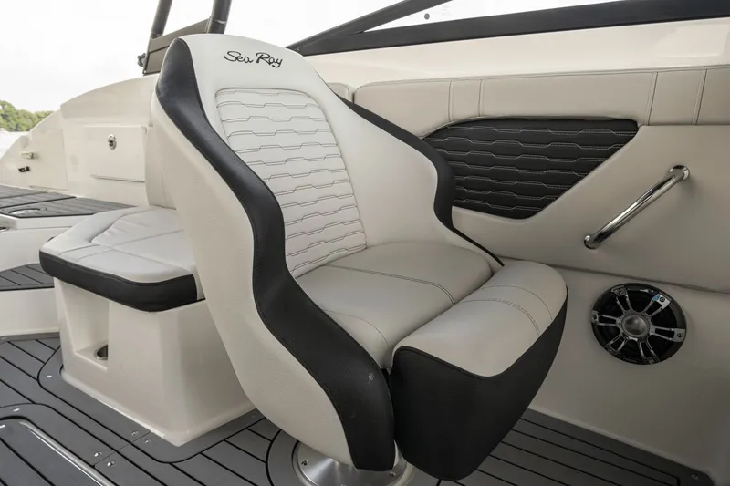 Slide: The Image of The interior of the Sea Ray SPX 230 Outboard features a sleek, upholstered seat with modern design. - 13