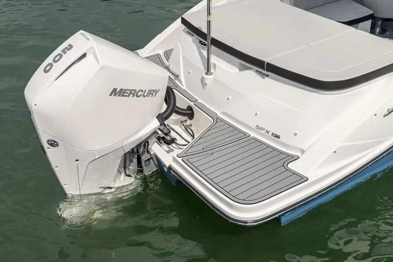 Slide: The Image of The image shows the rear of a 2024 Sea Ray SPX 230 Outboard with a Mercury engine. - 18