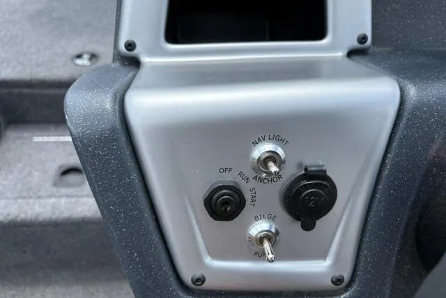 Slide: The Image of Control panel of 2025 Tracker Off Road Pro Team 175 boat, featuring navigation and bilge switches. - 19