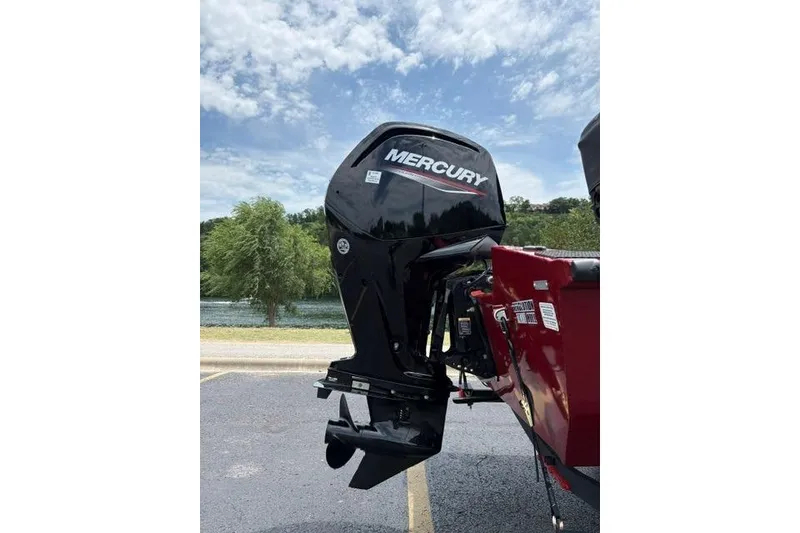 Slide: The Image of 2025 Tracker Off Road Pro Team 175 with Mercury outboard motor, parked outdoors. - 46