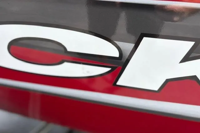 Slide: The Image of Close-up of 2025 Tracker Off Road Pro Team 175 logo on red background. - 42