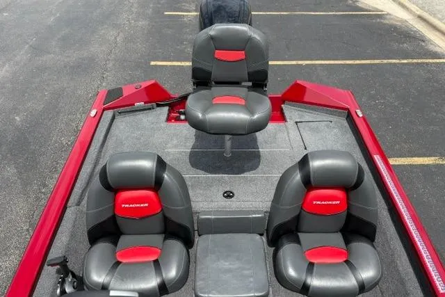 Slide: The Image of 2025 Tracker Off Road Pro Team 175 boat interior with red and black seating. - 35