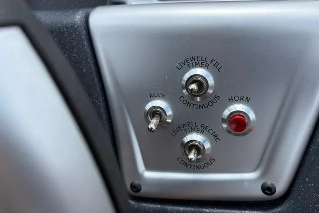 Slide: The Image of Control panel of 2025 Tracker Off Road Pro Team 175 with switches and horn button. - 18
