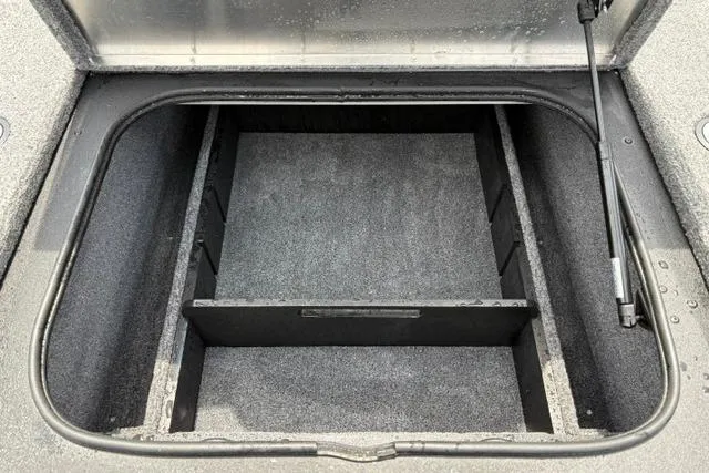 Slide: The Image of Open storage compartment in 2025 Tracker Off Road Pro Team 175 boat. - 15