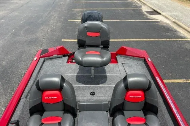 Slide: The Image of 2025 Tracker Off Road Pro Team 175 boat with red and black seating. - 34