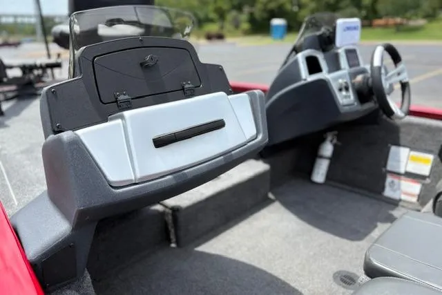 Slide: The Image of 2025 Tracker Off Road Pro Team 175 boat interior with steering console and seating. - 26