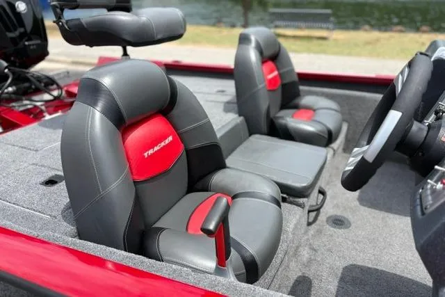 Slide: The Image of 2025 Tracker Off Road Pro Team 175 boat interior with gray and red seating. - 28