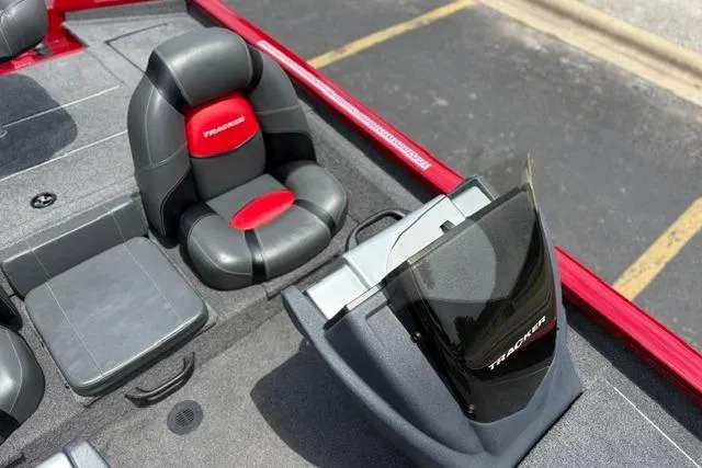 Slide: The Image of 2025 Tracker Off Road Pro Team 175 boat interior with red and black seating. - 36