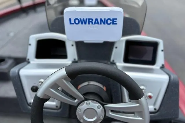 Slide: The Image of Steering wheel and dashboard of 2025 Tracker Off Road Pro Team 175 boat with Lowrance display. - 21