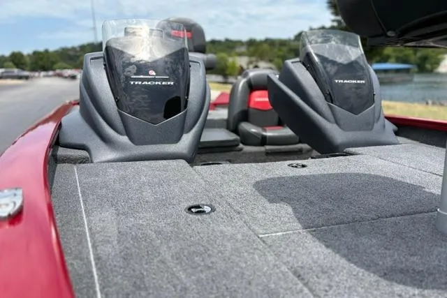 Slide: The Image of 2025 Tracker Off Road Pro Team 175 boat with dual consoles, docked by a scenic lake. - 32