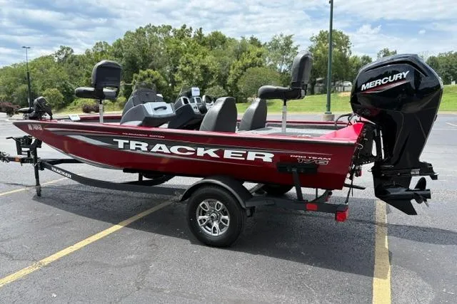 Slide: The Image of 2025 Tracker Off Road Pro Team 175 boat with Mercury engine in parking lot. - 6