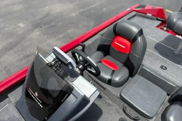 Slide: The Image of 2025 Tracker Off Road Pro Team 175 boat interior with steering wheel and seating. - 12
