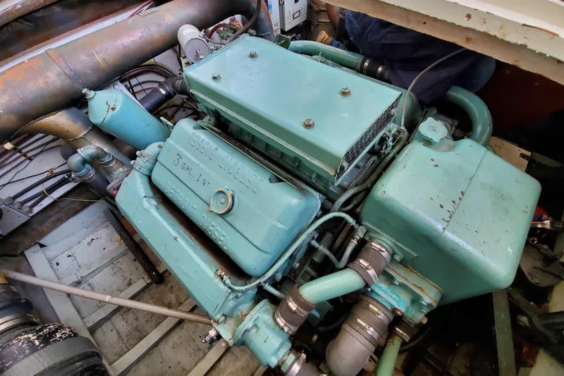 Slide: The Image of Engine of a 1971 Monk 44 Express Bridge boat, showcasing vintage marine machinery. - 9