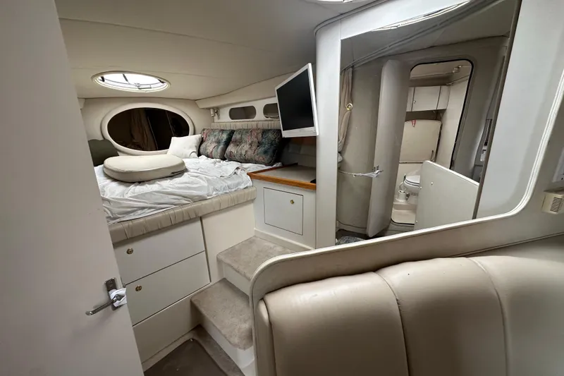 Slide: The Image of Interior of 1995 Cruisers Yachts 3575 Esprit with bed, TV, and bathroom. - 26