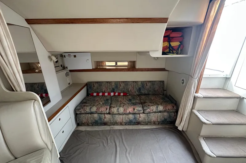 Slide: The Image of Interior of 1995 Cruisers Yachts 3575 Esprit with cozy seating and storage. - 24