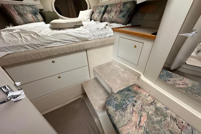 Slide: The Image of Interior cabin of 1995 Cruisers Yachts 3575 Esprit with bed, storage, and seating. - 34