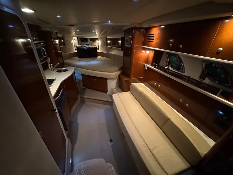 Slide: The Image of Interior of a 2008 Sea Ray Sundancer 310 with elegant wood paneling and comfortable seating. - 29