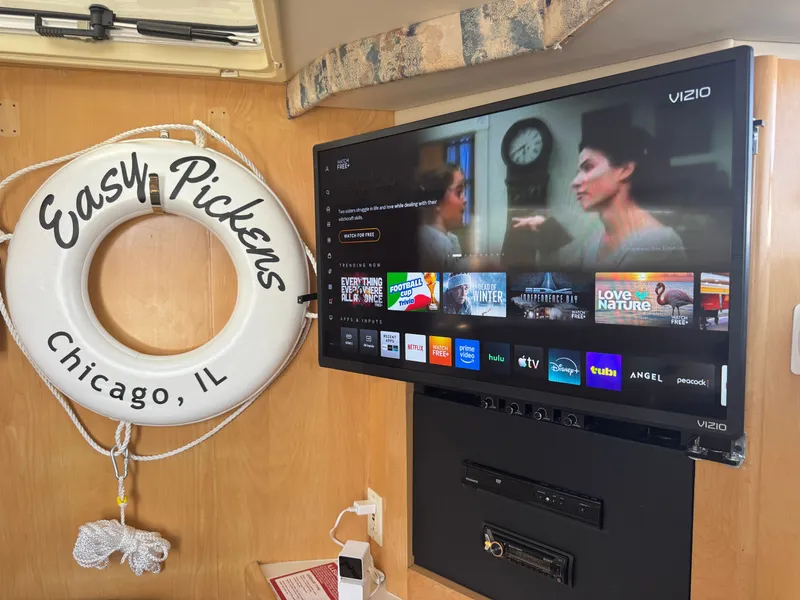 Slide: The Image of Interior of a boat with a TV and a life ring. - 9