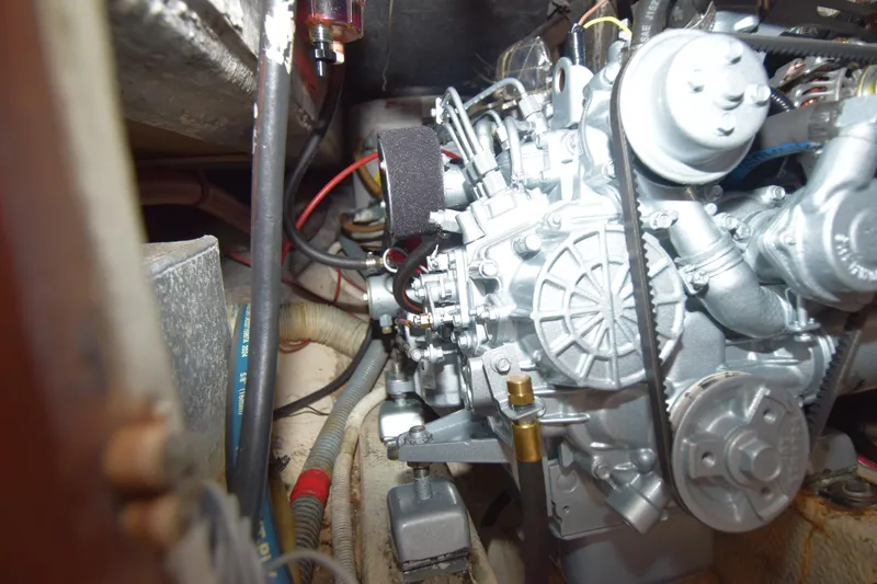 Slide: The Image of Engine compartment of a 1991 Catalina 38 sailboat, showcasing detailed mechanical components. - 11
