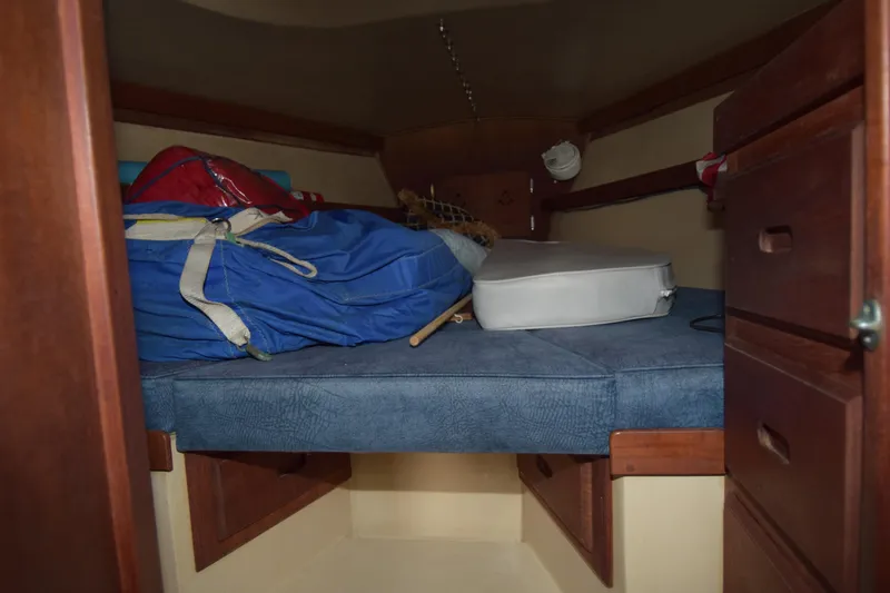 Slide: The Image of Interior cabin of a 1991 Catalina 38 sailboat with storage and cushions. - 3