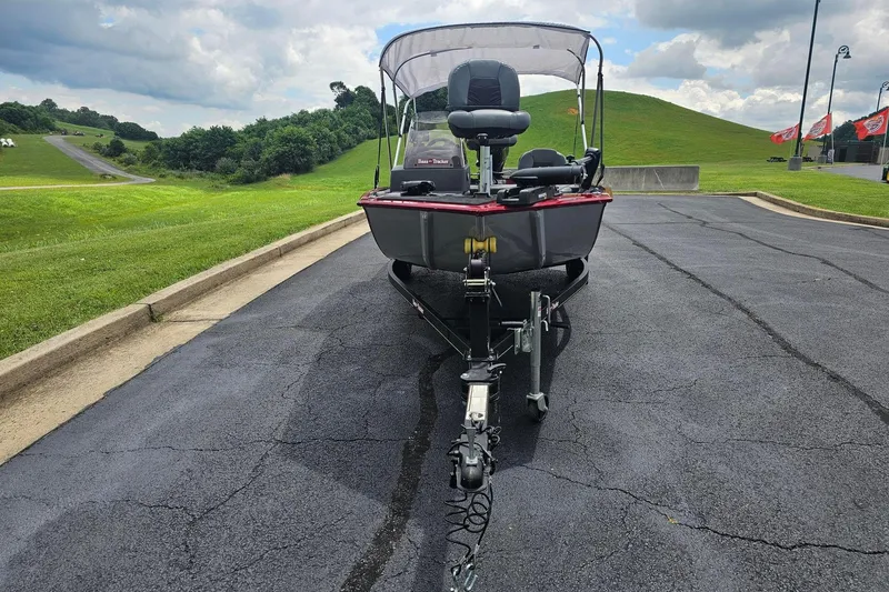 Slide: The Image of 2020 Tracker Bass Tracker Classic XL boat on trailer, parked on asphalt near grassy hills. - 8