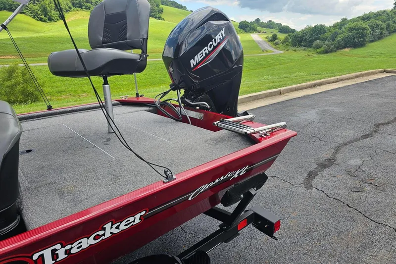 Slide: The Image of 2020 Tracker Bass Tracker Classic XL boat with Mercury engine on a scenic road. - 11