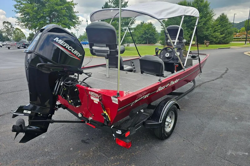 Slide: The Image of 2020 Tracker Bass Tracker Classic XL boat with Mercury engine, parked outdoors. - 4