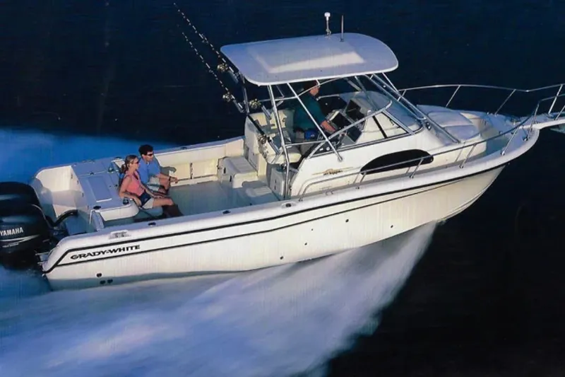 Slide: The Image of 2005 Grady-White Gulfstream 232 boat cruising on water at high speed. - 0