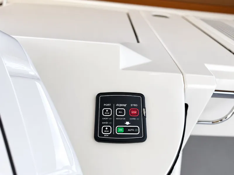 Slide: The Image of Close-up of a control panel on a white surface with various buttons and indicators. - 44