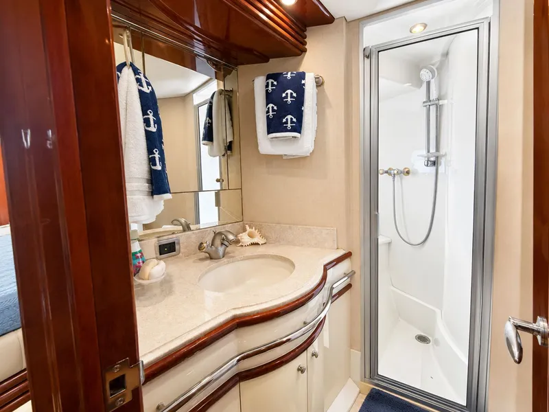 Slide: The Image of Luxurious bathroom with vanity, mirror, and shower in a yacht. - 17